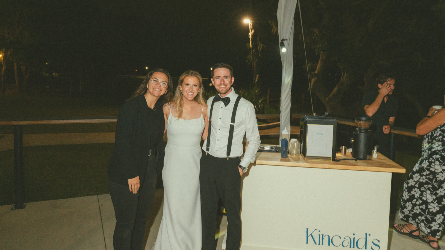 Wedding couple with Kincaid's barista at the espresso bar